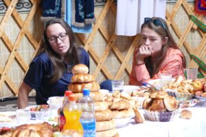 Sarah Lindell, left and guide Olga Kutischeva at a Kyrgyzstani "tea"