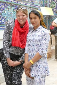 Katie Tackman of East Wenatchee poses with a young woman from Uzbekistan at a historical site in Samarkand